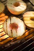 Peaches on a barbecue grill rack
