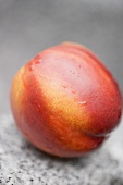 Nectarine with drops of water