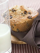 Chocolate chip muffin, glass of milk