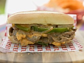 Döner sandwich with green peppers, onions and cheese