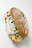 Bread roll filled with Obatzda (Camembert spread) & onions