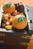 Assorted sweets for Halloween in treasure chest