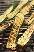 Slices of courgette on a barbecue