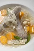 Vegetable soup with sausages