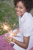 Woman holding sparklers