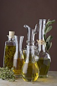 Various types of oil in carafes and bottles