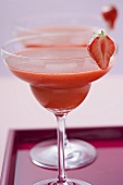 Two glasses of Strawberry Daiquiri on tray