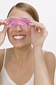Woman with a cooling eye mask