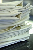 A pile of folded fabric napkins