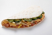 Tortilla filled with salsa, chillies and cheese