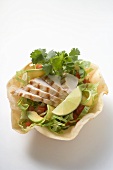 Chicken breast, avocado and lime in tortilla shell