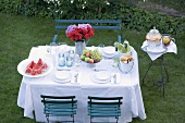 Table laid in garden for a summer party