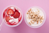 Strawberry yoghurt and natural yoghurt with cereal in pots