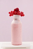 Berry shake in plastic bottle
