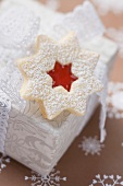 Jam-filled star biscuit on white box (Christmas)