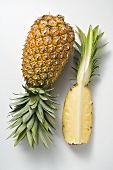 Whole pineapple with wedge of pineapple