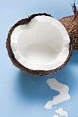 Half a coconut with coconut milk
