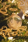 Painted Christmas tree bauble and gold chains