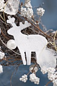 White reindeer on Christmas wreath (close-up)