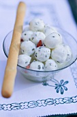 Marinated mozzarella balls with grissini
