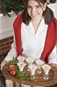 Young woman serving dessert (Christmas)