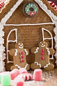 Gingerbread house with two gingerbread men