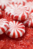 Peppermints on red sugar