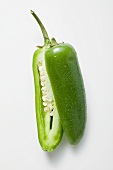 Green chilli with drops of water, halved