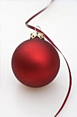 Red Christmas bauble with ribbon