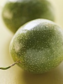 Two green passion fruits