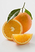 Orange with stalk and leaf, orange half and wedge