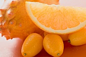 Kiwano, kumquats and wedge of orange