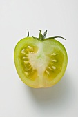 Half a green tomato (overhead view)