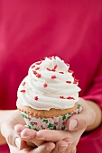 Woman holding cupcake (Christmas)