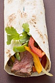 Wrap filled with beef and peppers