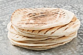 A stack of grilled flatbread