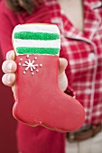 Woman holding red gingerbread boot