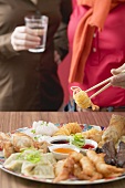 Two women with Asian appetiser platter