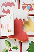 Advent calendar with boot-shaped biscuit