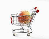 Apple in toy shopping trolley