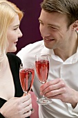 Couple clinking glasses of sparkling wine