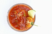 Tomato dip with wedge of lime