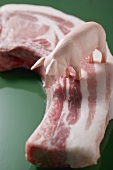 Toy pig on organic pork chop