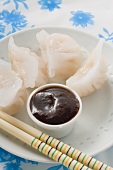 Dim sum with dip on plate (Asia)