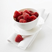 Fresh raspberries in a bowl on a napkin
