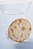 Cracker in front of a schnapps glass