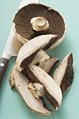 Portobello mushrooms, one sliced
