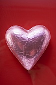 Heart-shaped chocolate in pink foil