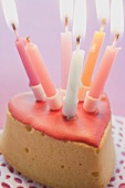 Small birthday cake with burning candles