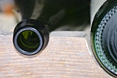 Bottles in wine rack (close-up)